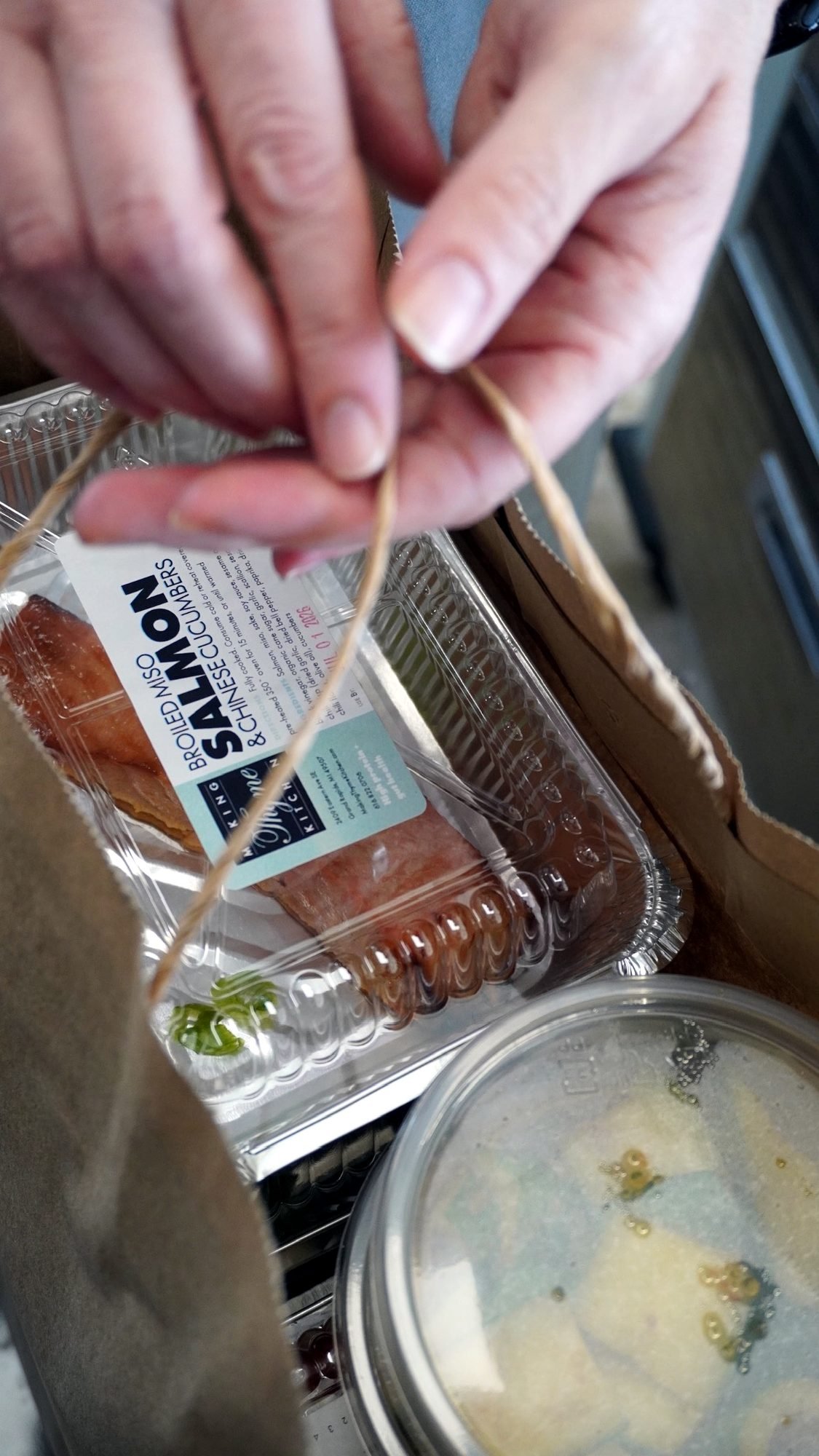 A bag of fresh prepared meals from Making Thyme Kitchen