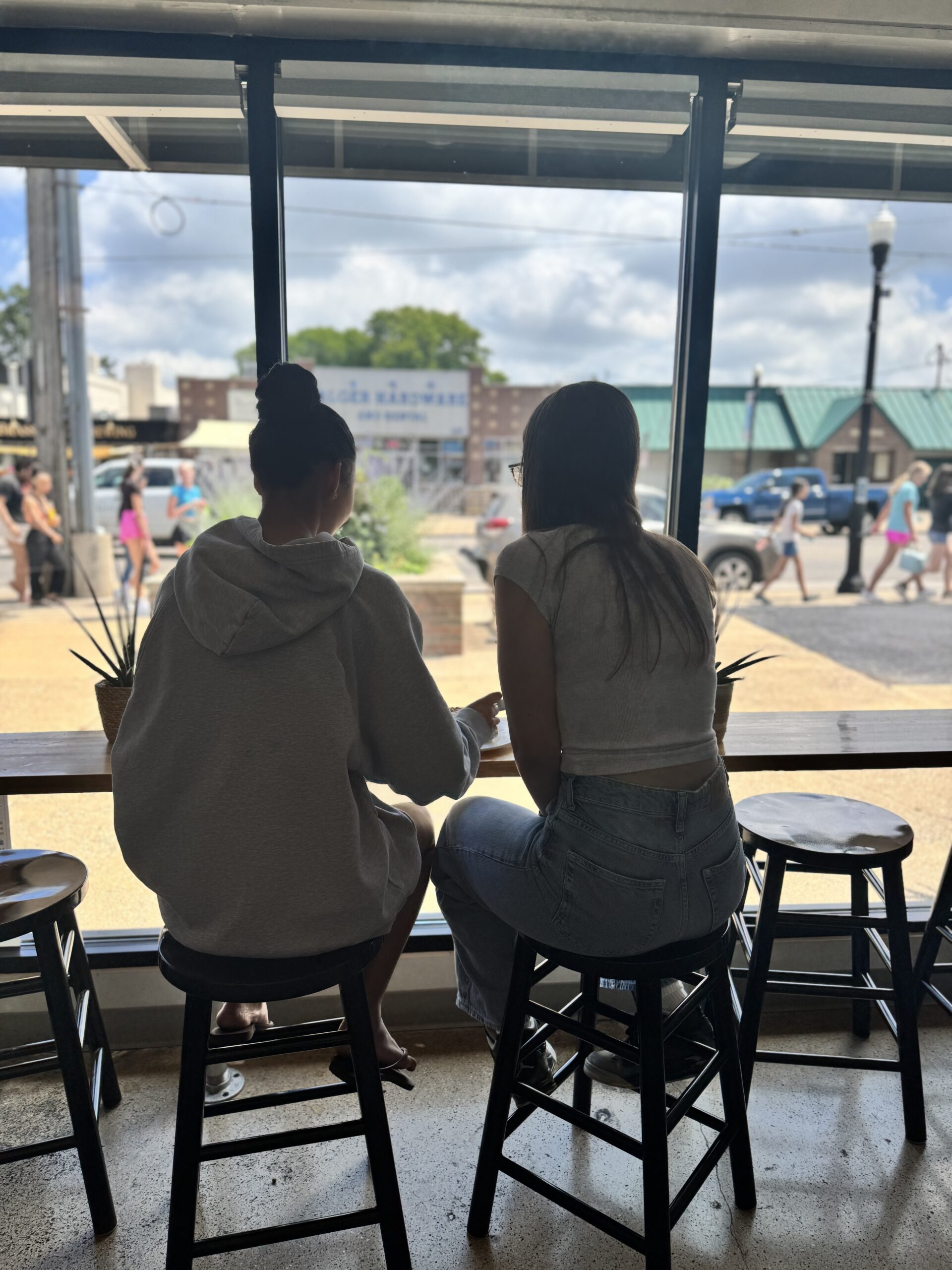 Customers at the window counter, looking out over Alger Heights
