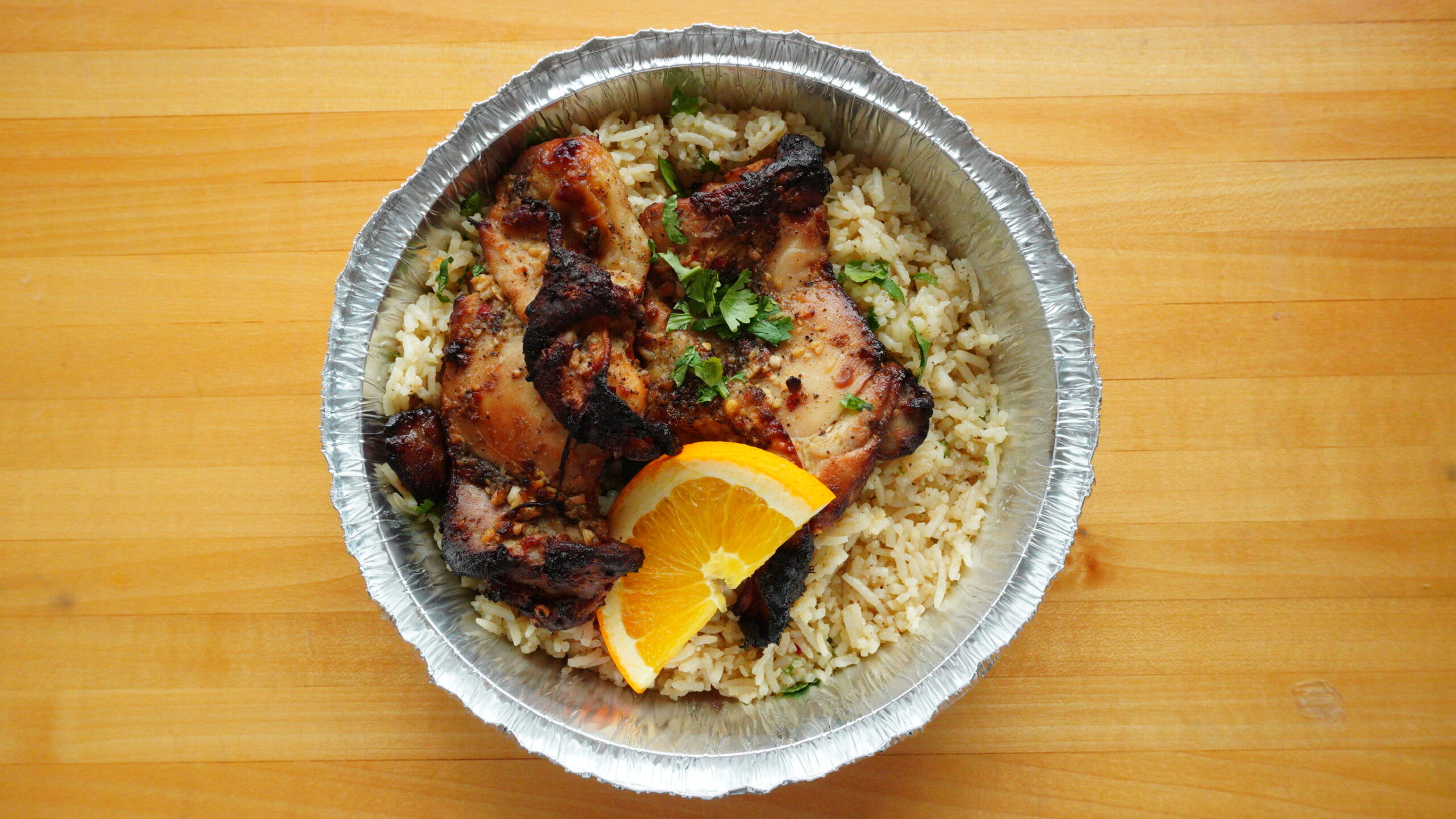 A scratch-made entree packed in a pan, ready to reheat